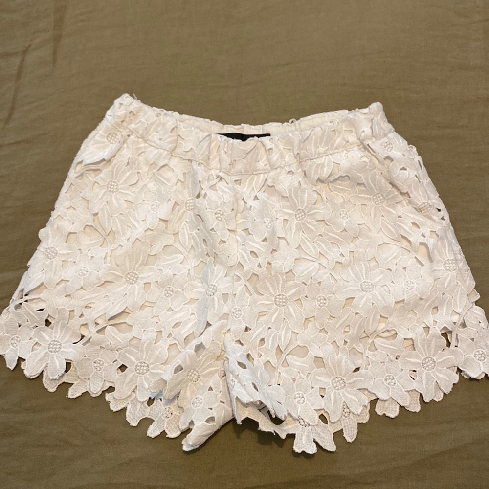 White lace shorts with a white lining. Brand of shorts is just female